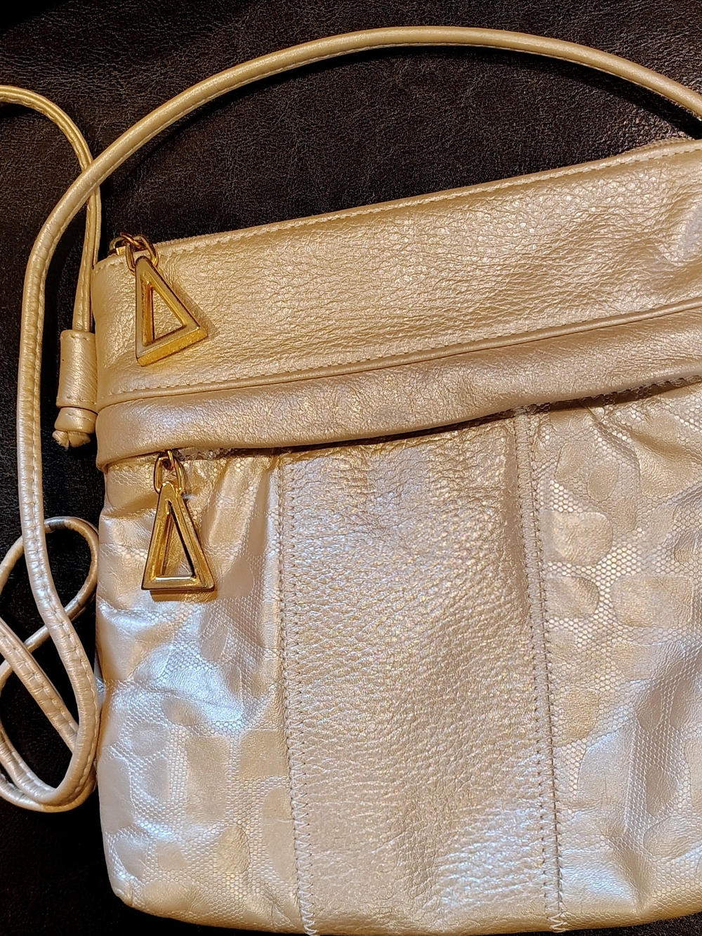 Talk of the Walk Metallic Beige  Crossbody Bag with Gold Triangle Zip Pulls.